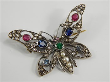 Lot 241 A yellow metal diamond and gem set butterfly brooch