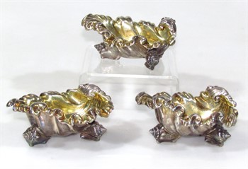 1026 A pair of William IV crested silver salts, by Paul Storr and another salt designed to match by Edward, Edward junior, John & William Barnard