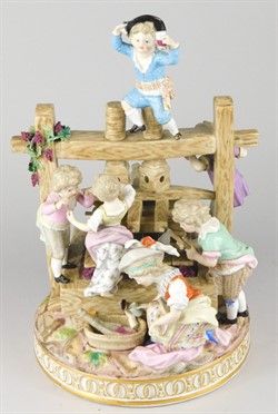 2014 A 19thC Meissen figure group, in the form of various children around a wine press